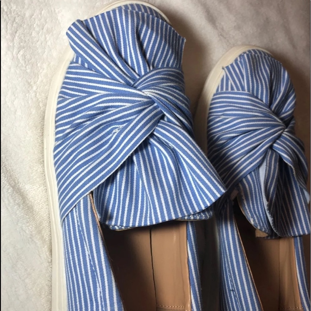 Blue and white striped slip on shoes.